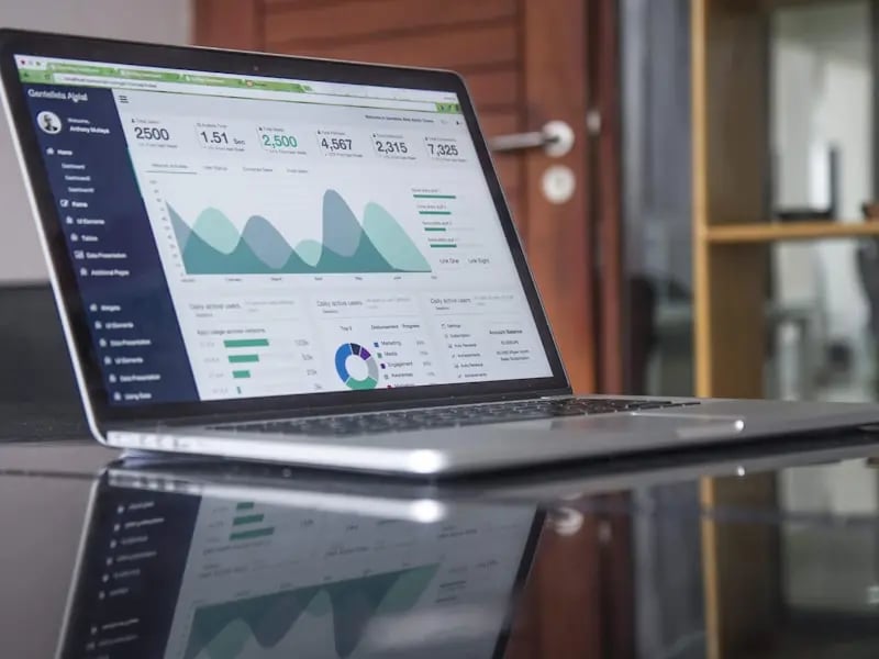 Excel spreadsheet with financial data and calculations on a modern laptop