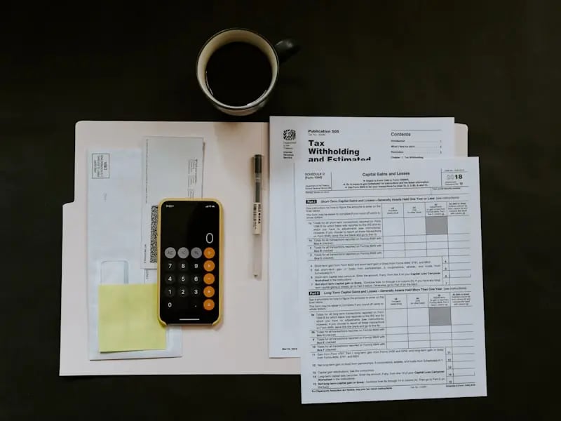 Professional invoice template on desk with calculator and pen