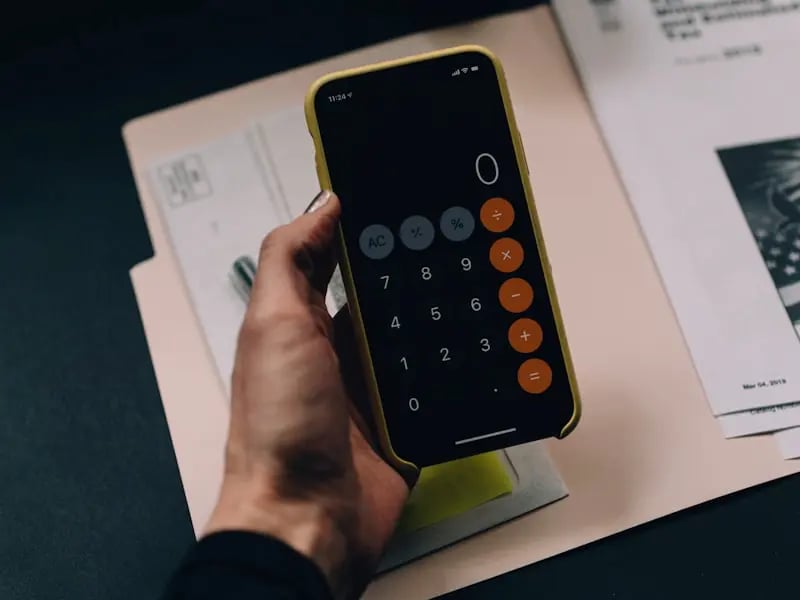 Calculator and financial documents showing tax calculations